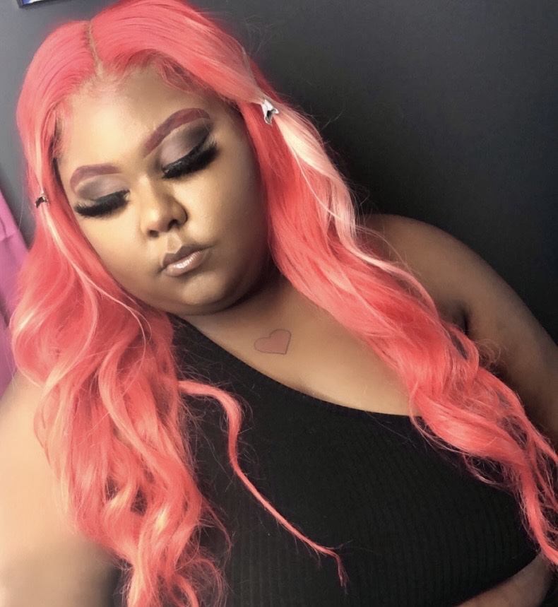 Client with pink hair and full glam makeup
