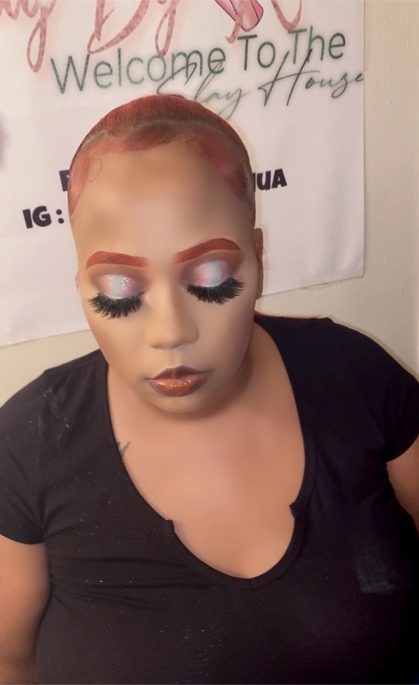 Client with rose hair, shimmery eye makeup, and lashes